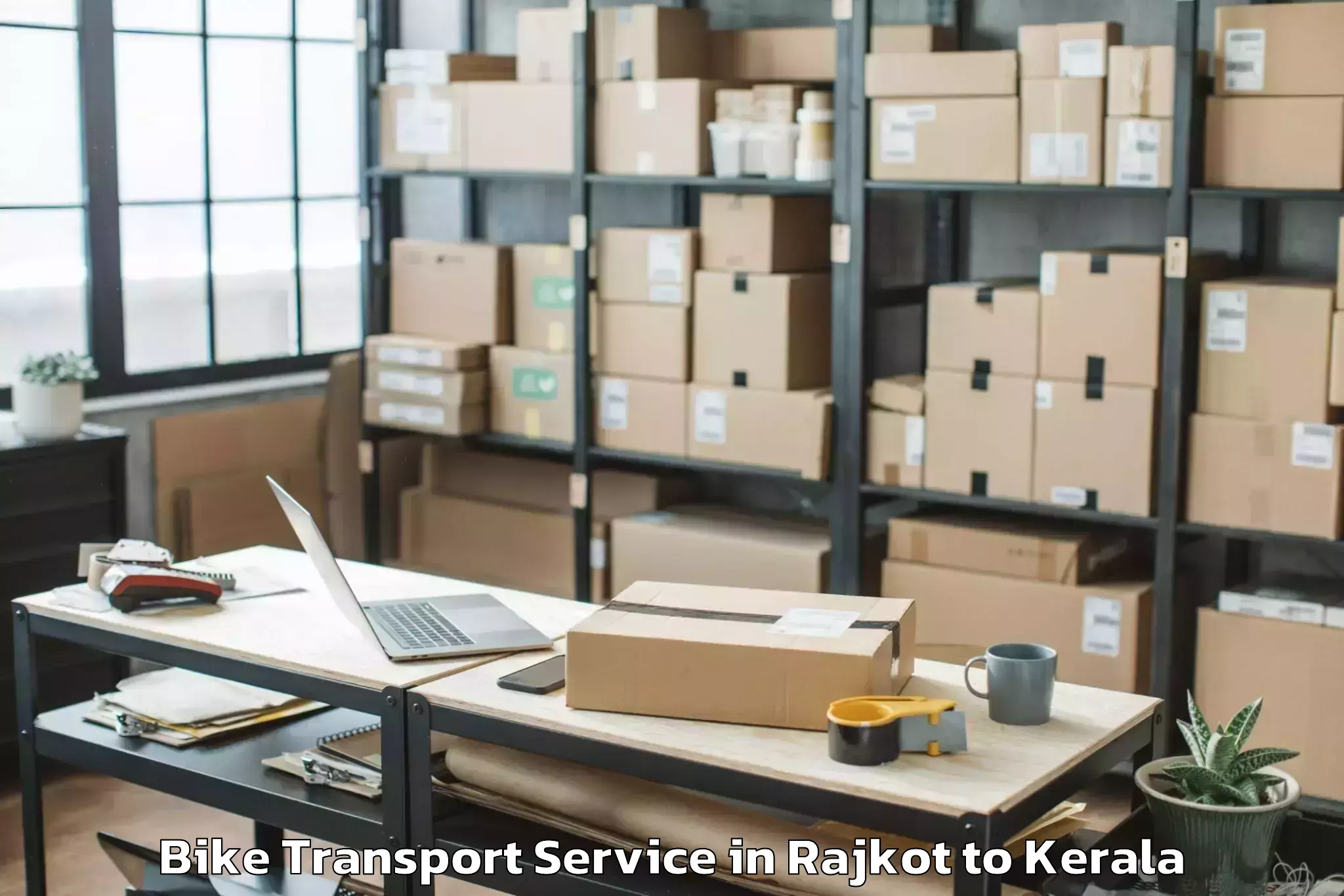 Hassle-Free Rajkot to Central University Of Kerala K Bike Transport